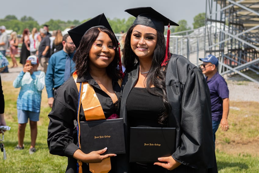 Proud graduates (L) Myeesa Jones (Mount Vernon)and (R) Jaylen Powell (Carbondale) display their diplomas on Saturday.