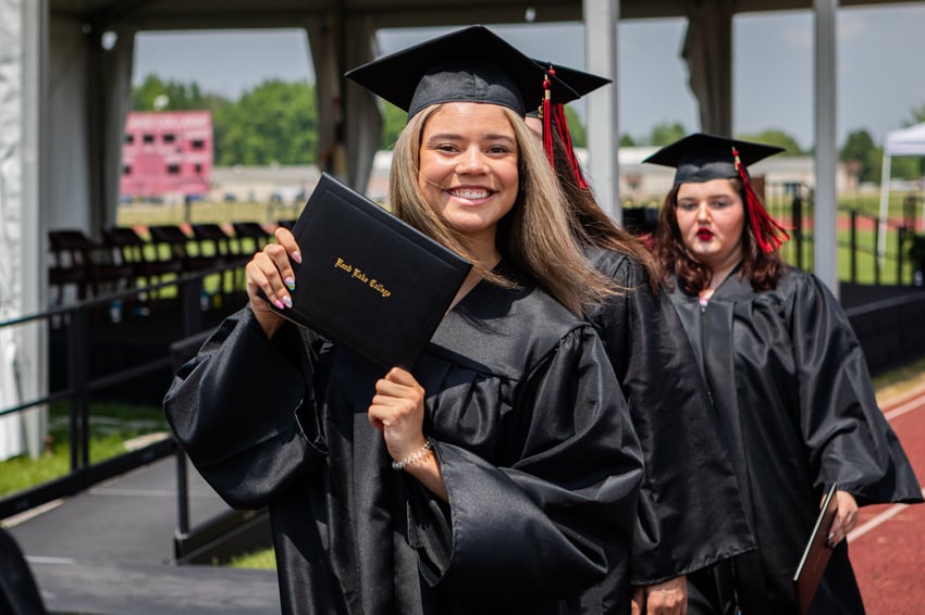 (Rend Lake College graduate and student volleyball athlete Alexis Turner (Johnston City) proudly shows off her new diploma from her Associate of Arts degree.)