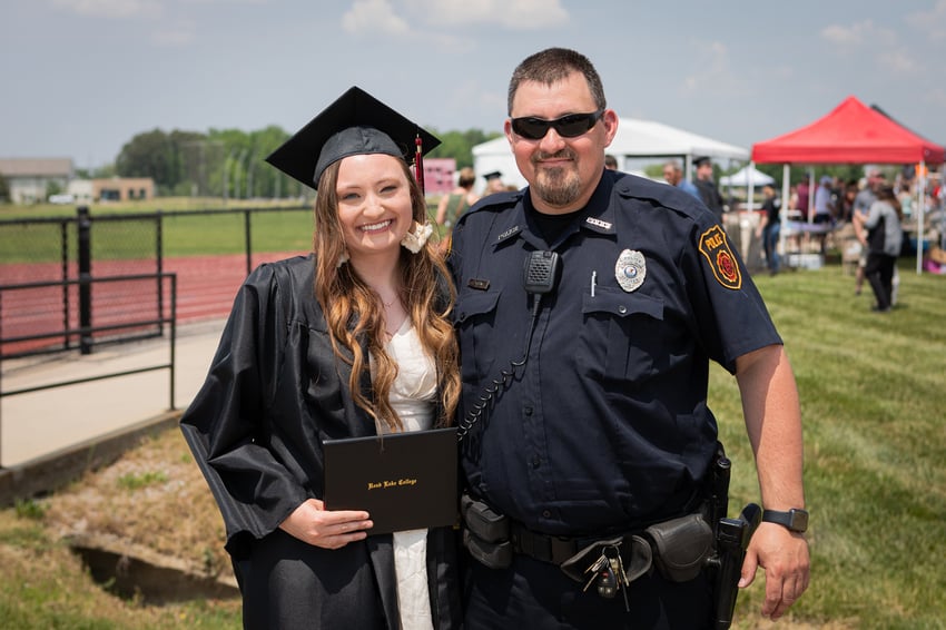 (Rend Lake College Graduate, Morgan Young, with father, Jeremy Young.)