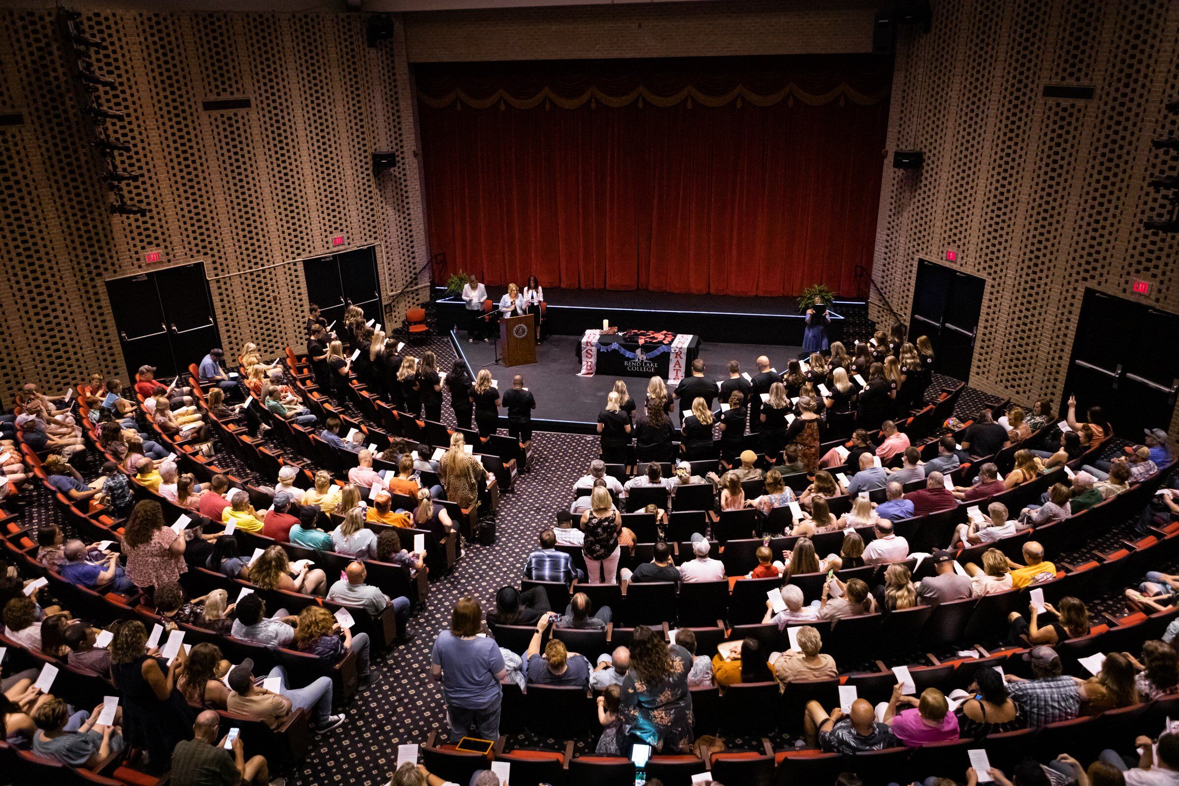 Families and friends gather in the Rend Lake College Theater to celebrate 2022 Associate of Nursing Degree Graduates.