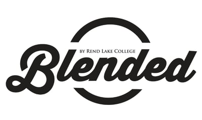 A black logo featuring the word "Blended" in a cursive script font overlaid across a partial circle, with the text "BY REND LAKE COLLEGE" centered above the word.