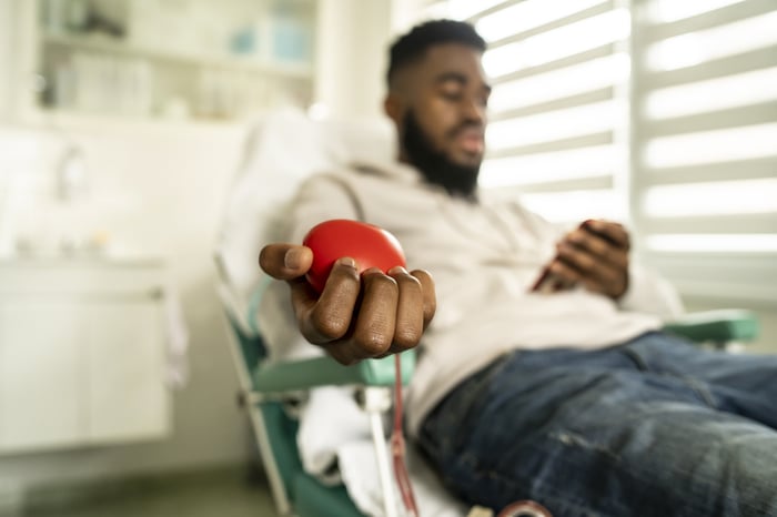 Person donating blood at blood drive