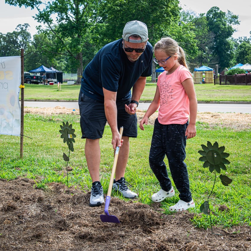 Nathan and Isla Wheeler digging a hole