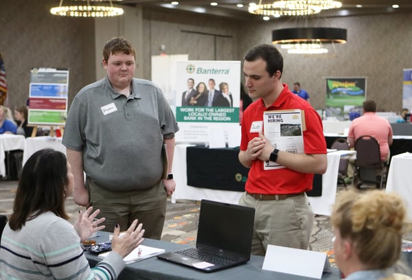 Braden Young (LEFT) and Jacob Parks, both of Mt. Vernon, check out the WSIL TV3 booth at the Job Search Party. 