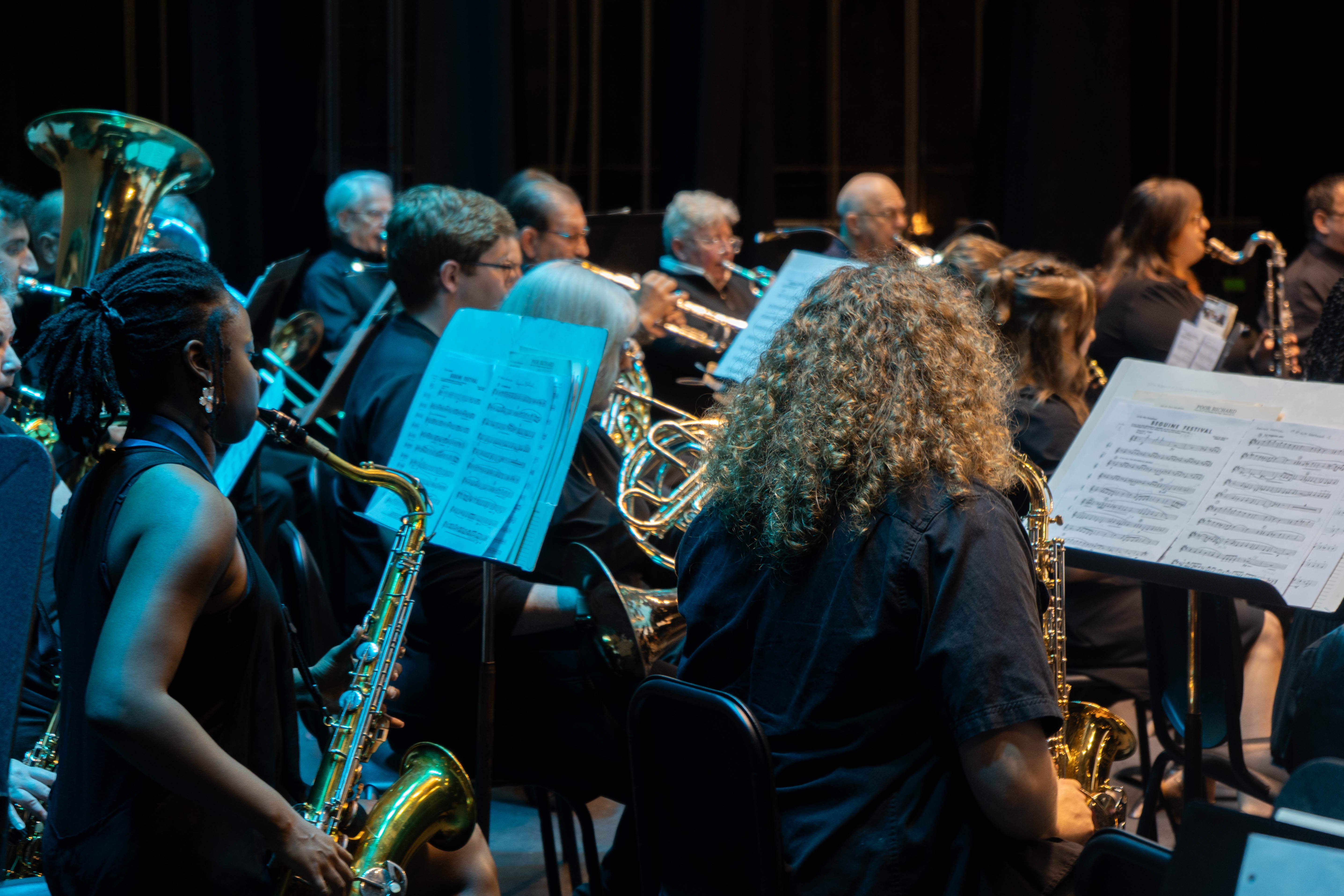Members of the Rend Lake College concert band, including saxophone and brass players, perform on stage during the 2026 Spring Concert: Chiaroscuro.