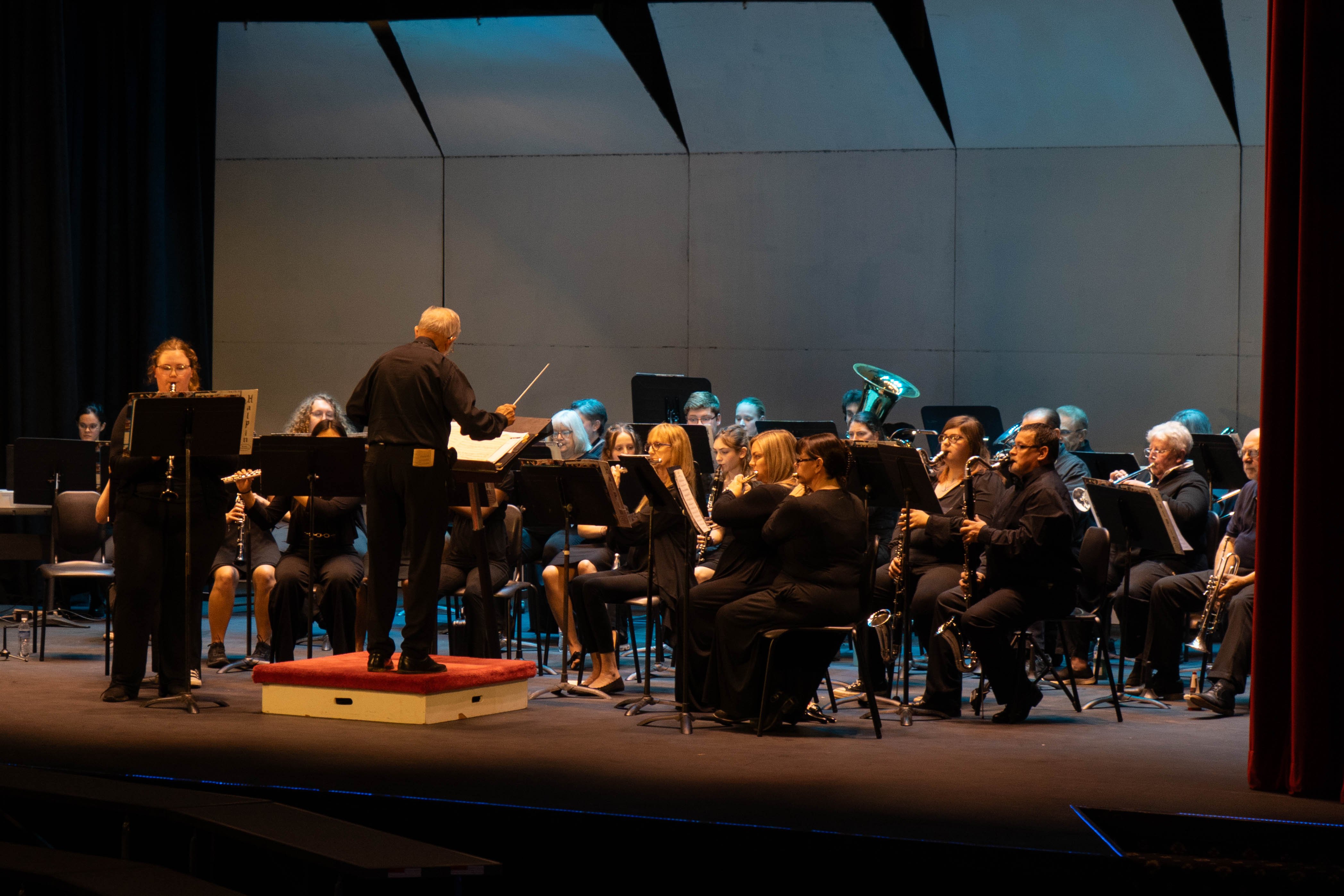  The Rend Lake College concert band performs on stage under the direction of conductor William Reynolds during the 2026 Spring Concert: Chiaroscuro.
