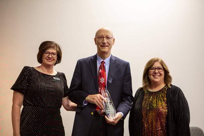 Randall Dauby (center) receives the Presidents award from RLC President Lori Ragland (right) and RLCF Director Amy Newell (left).
