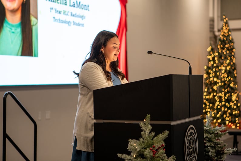 Amelia LaMont presenting a speech at the 46th Annual Dinner.