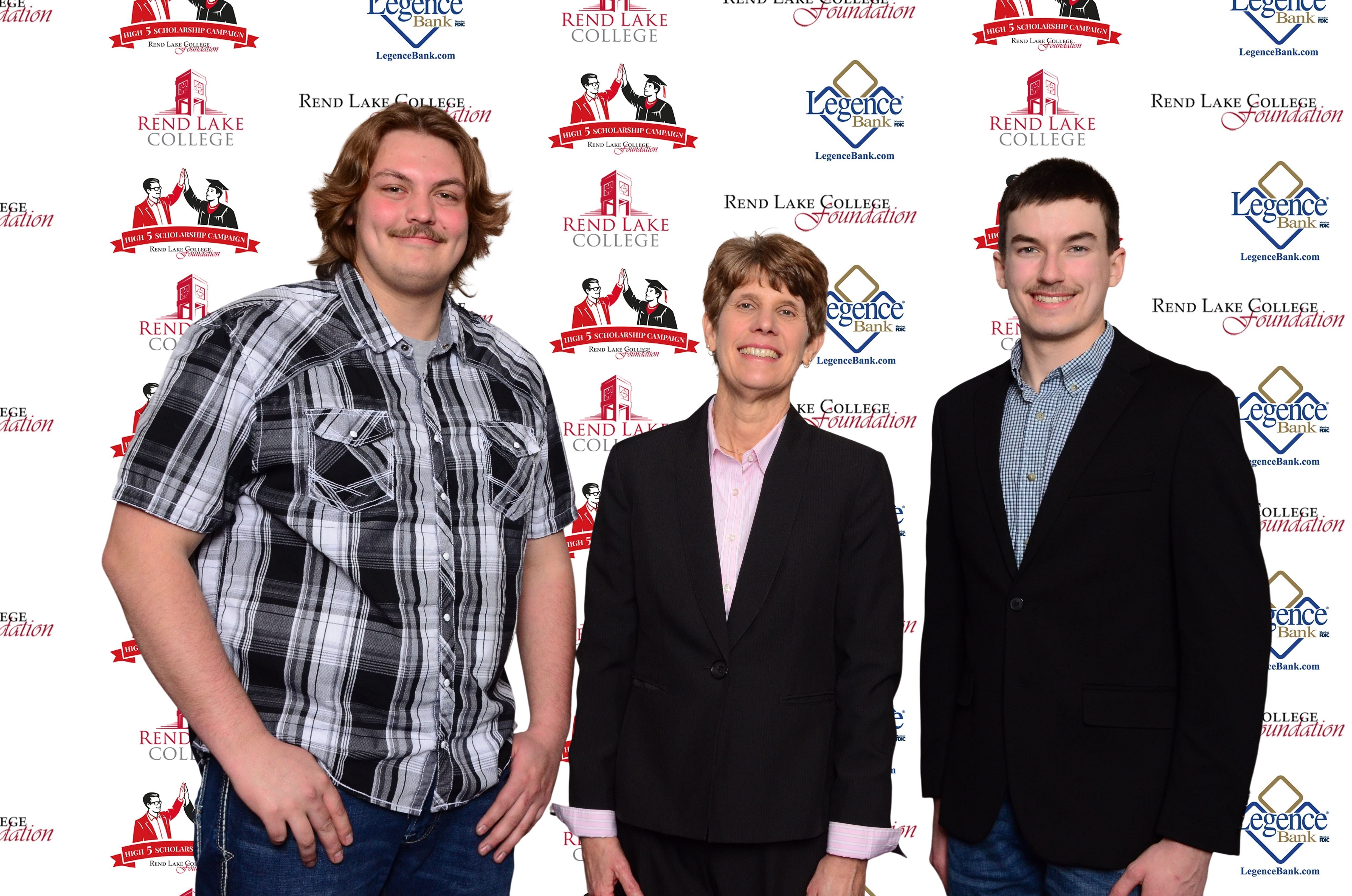 Pictured, (L-R) Scholarship Recipient Tanner Johnson, Scholarship Representative Trish Reed, Scholarship Recipient Isaac Holloway