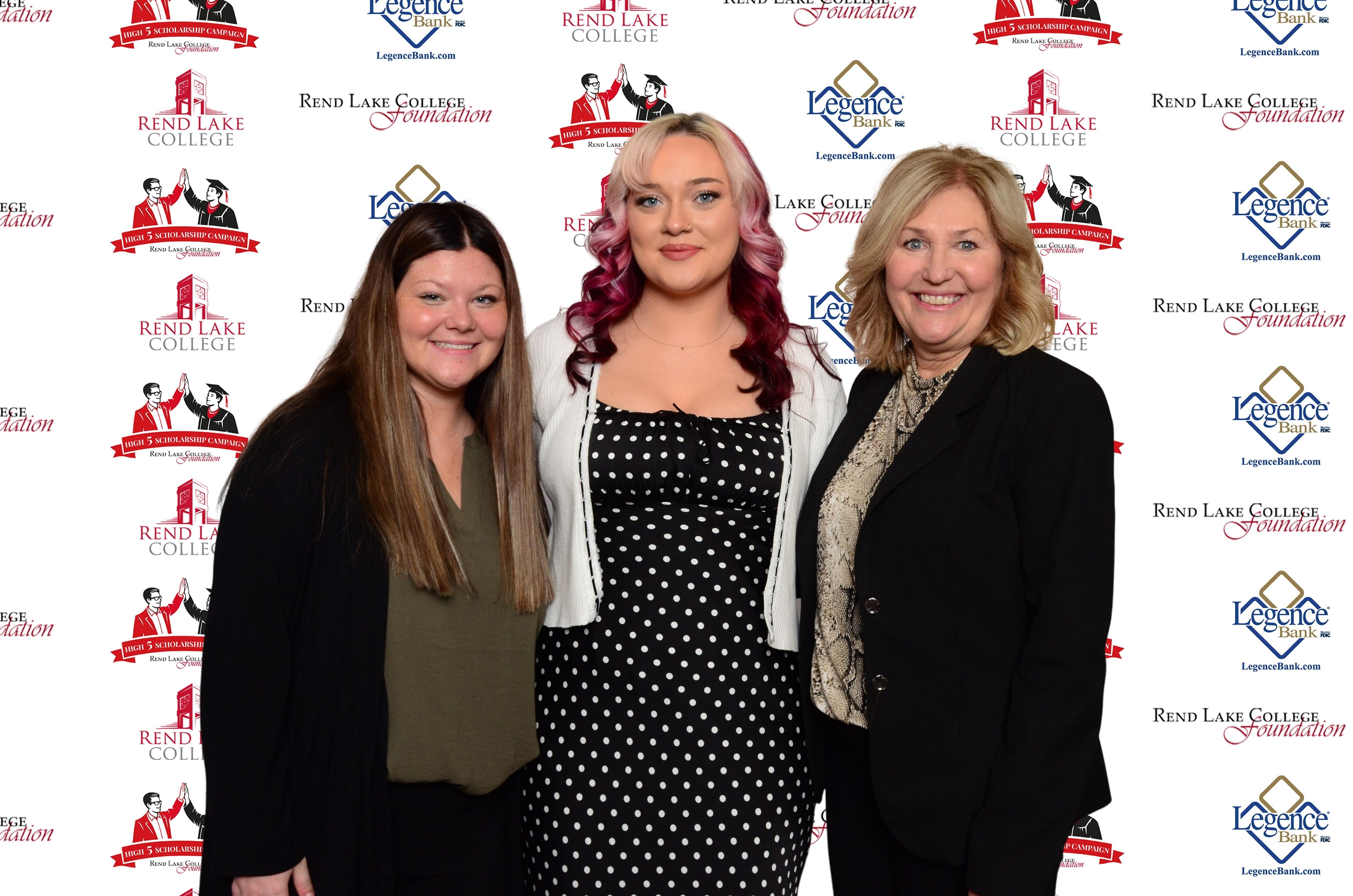 Pictured, (L-R) Scholarship Recipient Callie Robinson, Scholarship Recipient Emma Pierce, Scholarship Representative Pat Kern