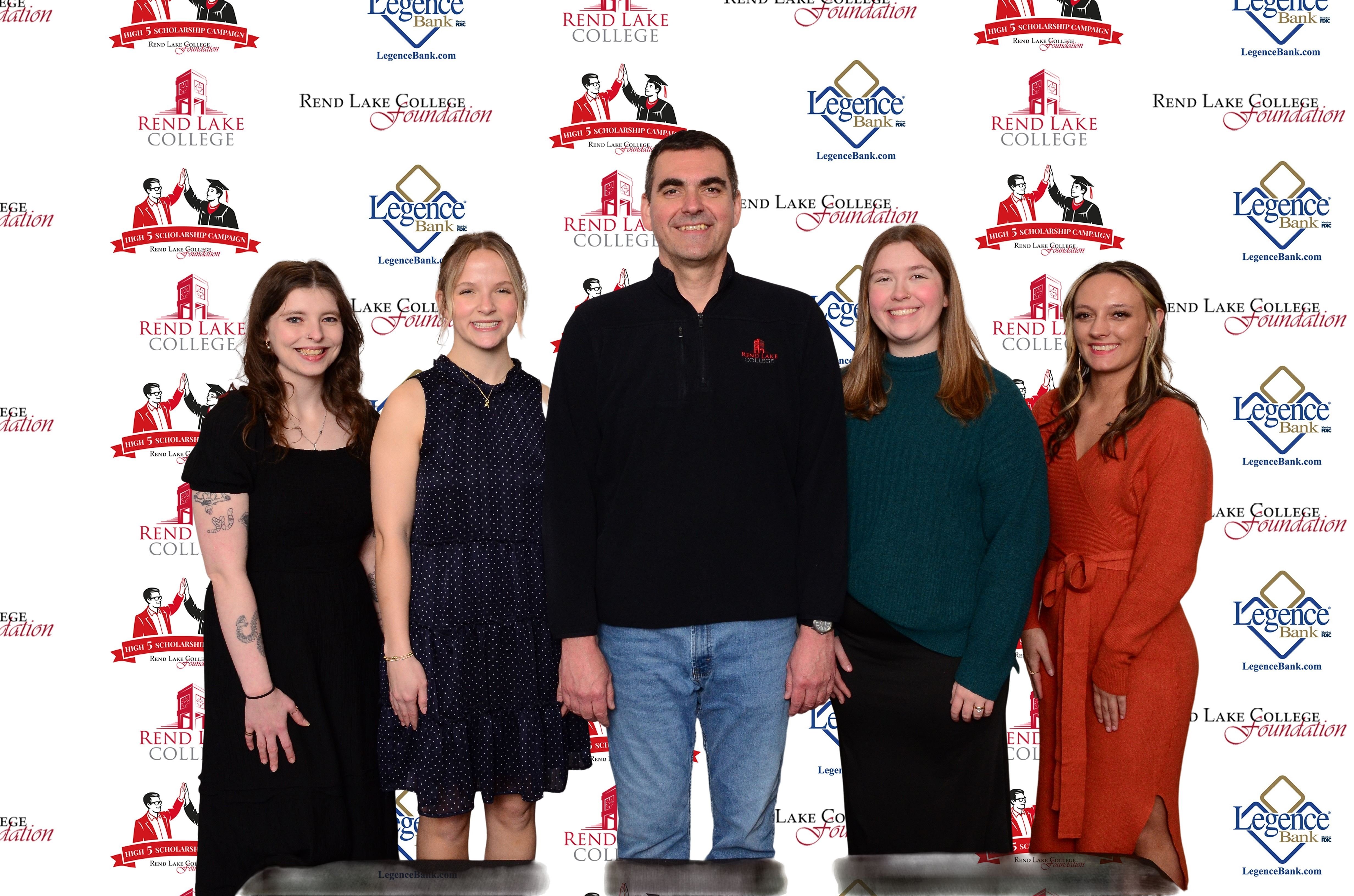 Pictured, (L-R) Scholarship Recipient Alexis Mendenhall, Scholarship Recipient Paige Greenwalt, Scholarship Representative Chad Copple, Scholarship Recipient Elizabeth Eastham, Scholarship Recipient Saylor Lappin
