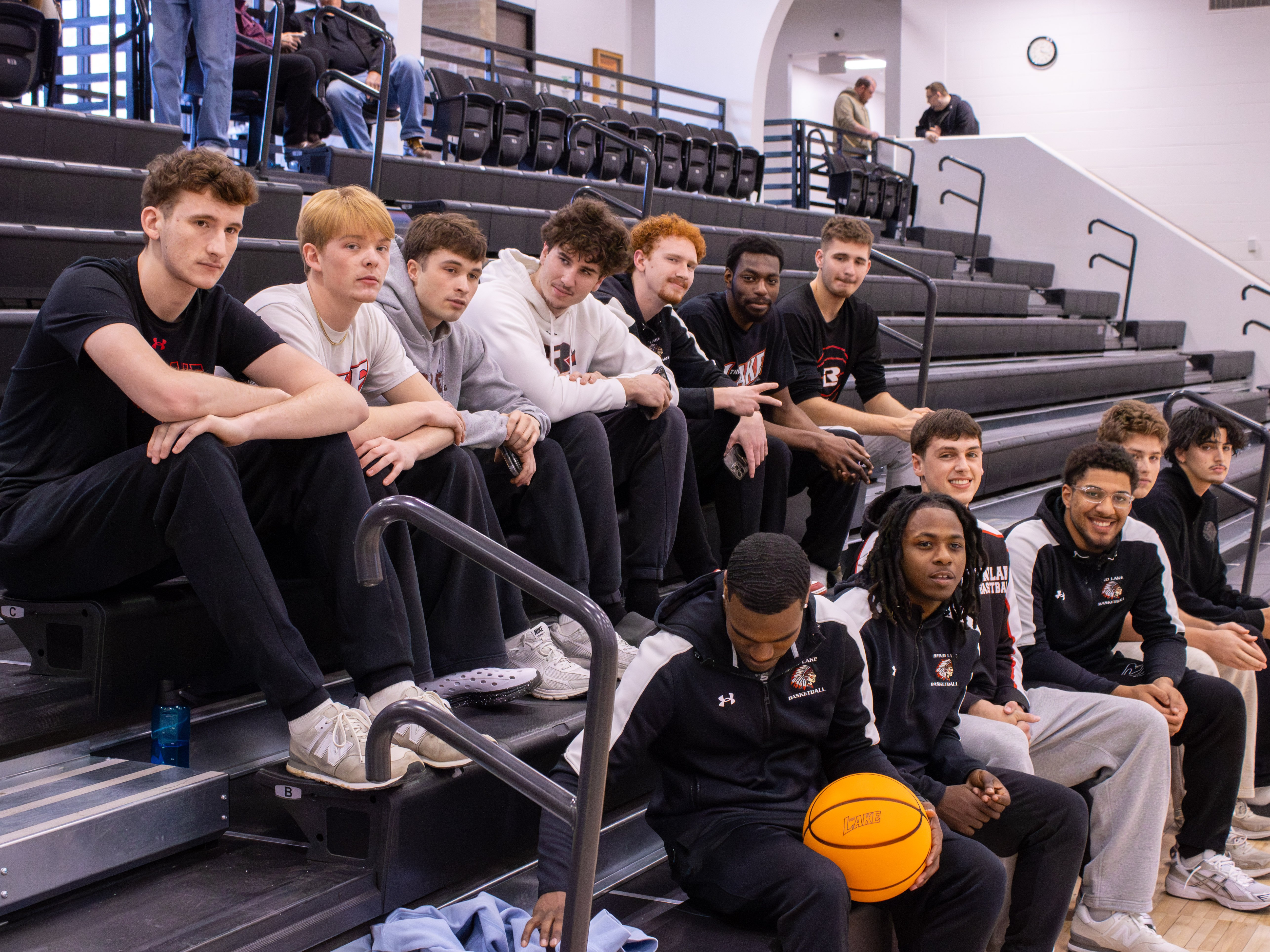 Members of the Rend Lake College (RLC) Warriors basketball team sit in the newly renovated bleachers during the Banterra Sports Complex ribbon-cutting ceremony on February 11, 2026.