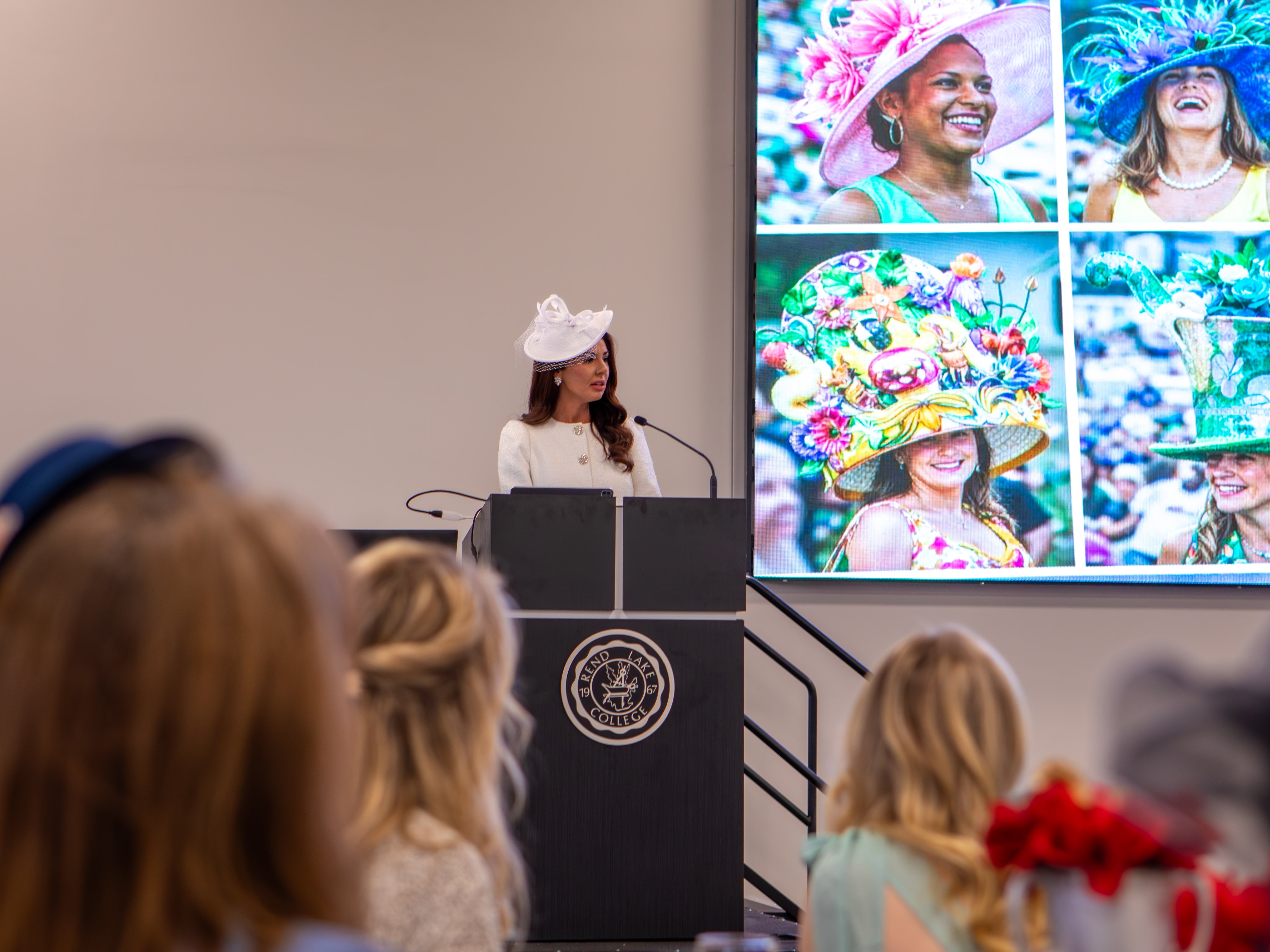 Christen Drew shares with the women at the High Tea the culture and history of the Kentucky Derby hats.