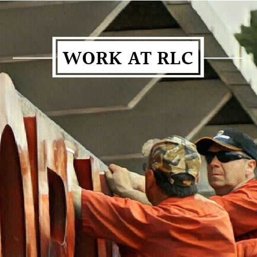 image of employees installing signage at RLC