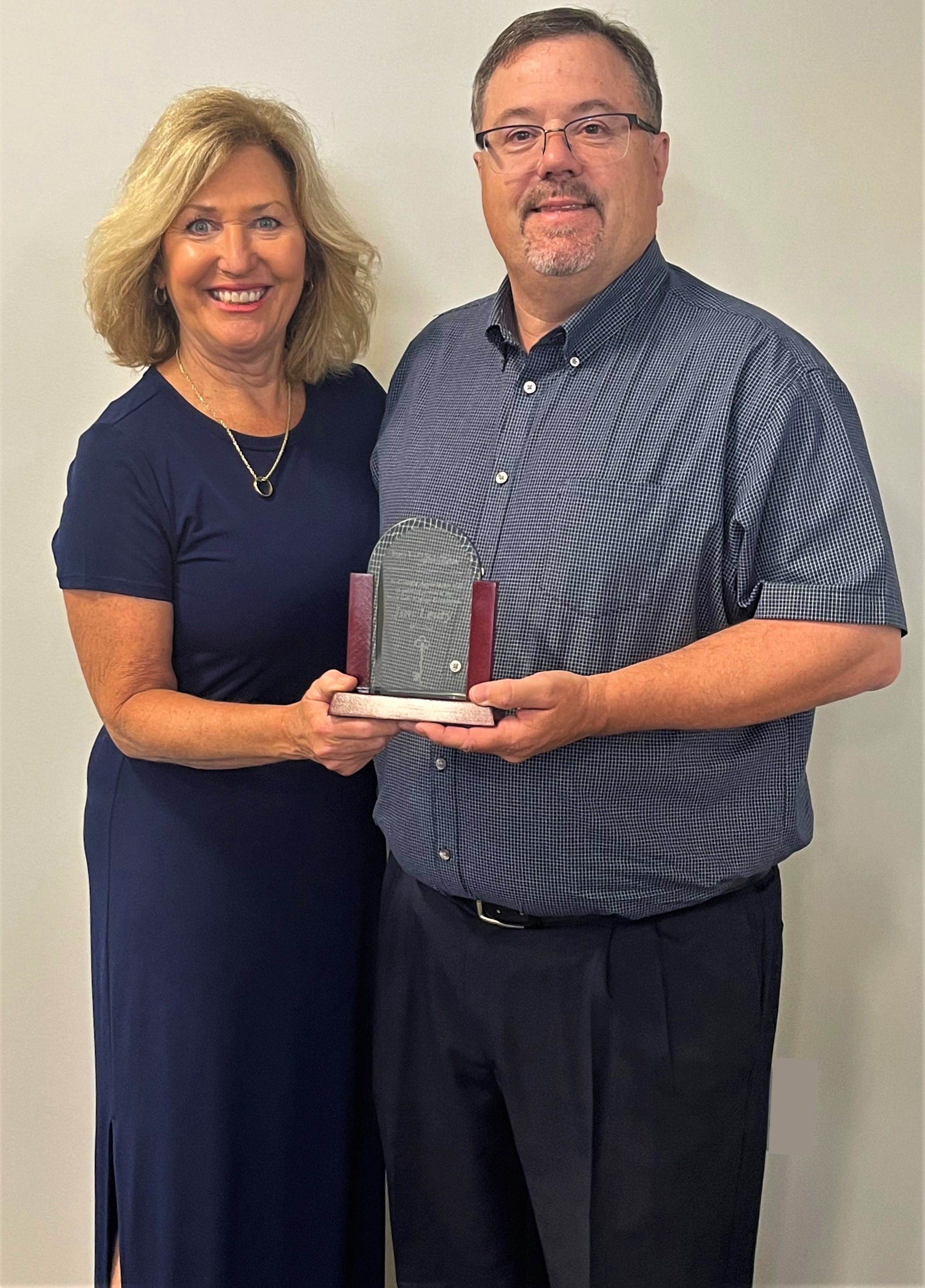 Jim Leuty (right) is pictured with RLC Foundation Interim CEO Pat Kern as he receives recognition for 11 years of service with the RLC Foundation Board of Directors.